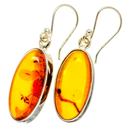 Amber oval drop earrings with 925 sterling silver hooks and frames, yellow-orange glossy