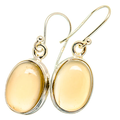 Oval moonstone drop earrings in sterling silver, yellow cabochons, with fishhooks