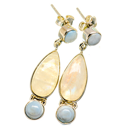 Silver-tone drop earrings with teardrop opal and moonstone accents, gold-tone hooks