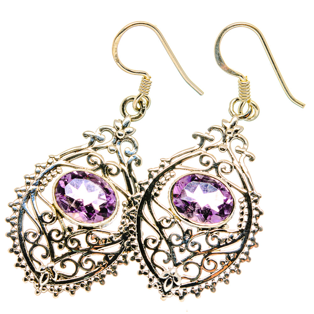 Dangling sterling silver filigree earrings with faceted amethyst purple circular stones