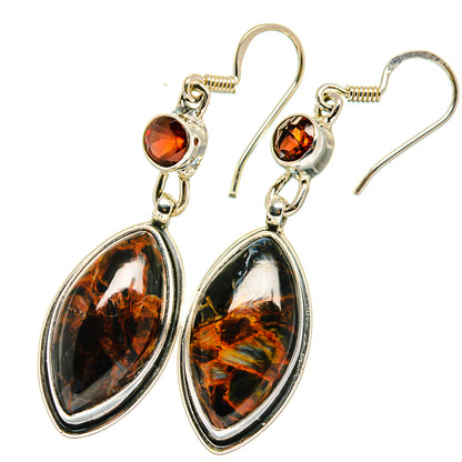 Sterling silver drop earrings with round garnet and oval pietersite stones, lever hooks