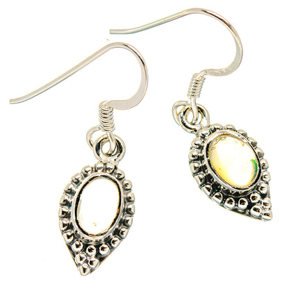 Sterling silver opal drop earrings with oval yellow stone in ornate bezel and hook backs
