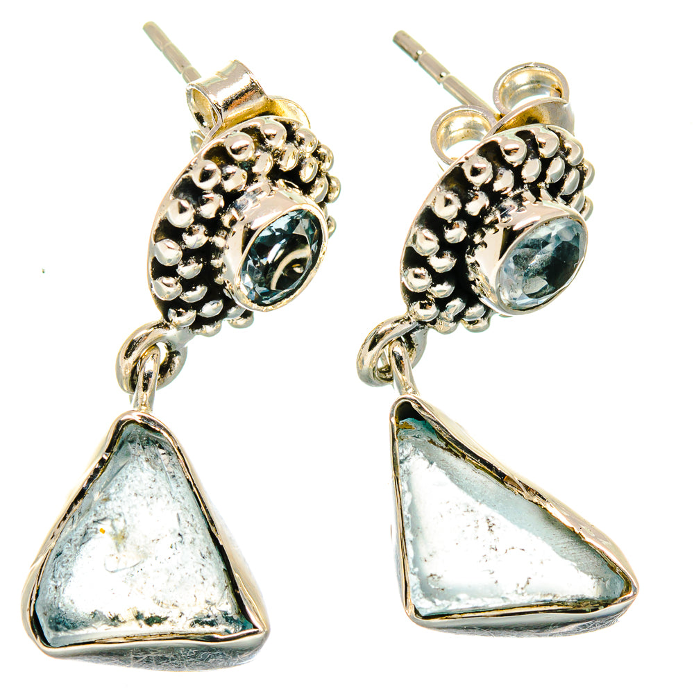 Sterling silver blue topaz stud earrings with triangular dangle and textured halo
