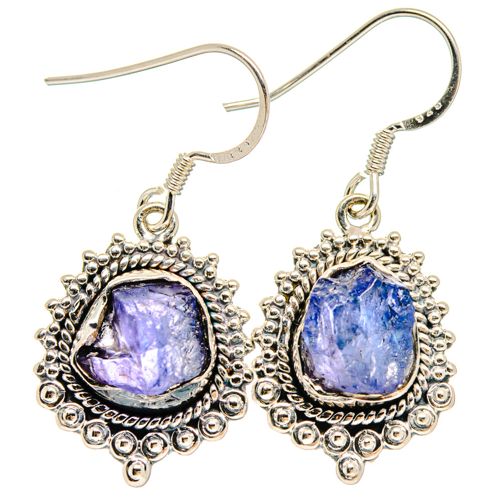Sterling silver rough tanzanite earrings with oval purple stones and ornate halo