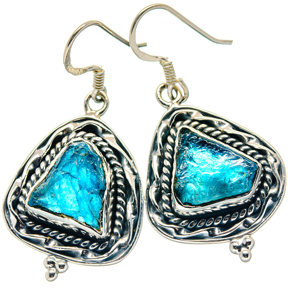 Sterling silver apatite dangle earrings with rough blue stones in decorative oval settings