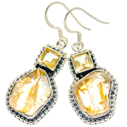 Sterling silver citrine drop earrings with rough yellow stones and ornate bezel settings