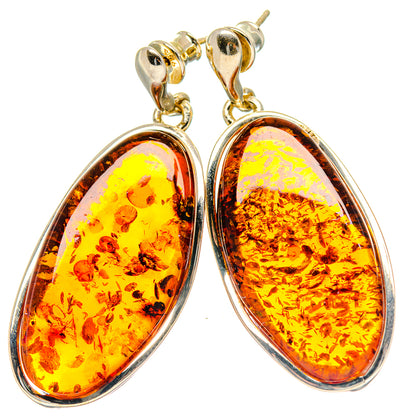Baltic amber oval dangle earrings with 925 sterling silver settings, hook backs