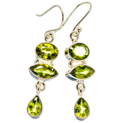 Sterling silver peridot drop earrings, three oval stones and one teardrop