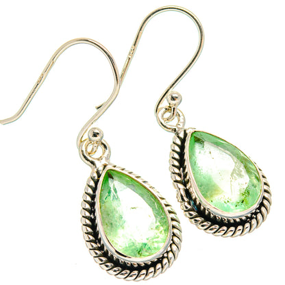 Silver teardrop fluorite earrings with bright green stones in braided bezel on hooks