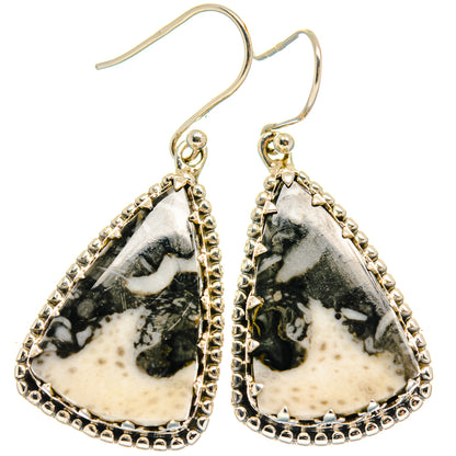 Sterling silver teardrop earrings with black-and-white stone and ornate bead border