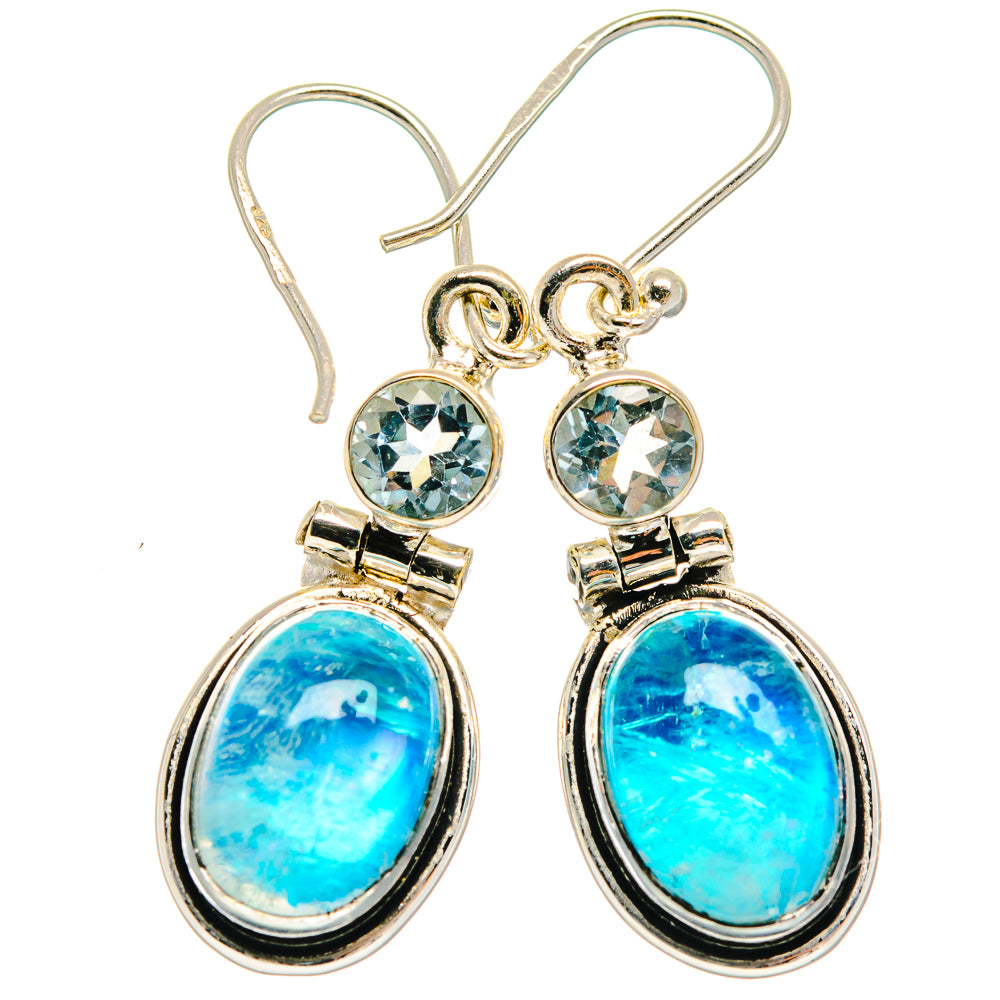 Sterling silver dangle earrings, oval blue stone with small round blue highlights