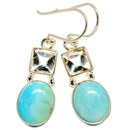Sterling silver drop earrings with blue oval stones and square dangling top frames