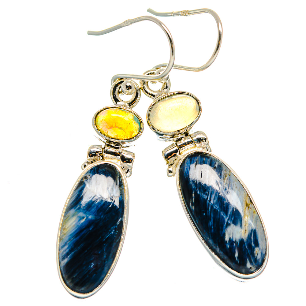 Sterling silver drop earrings with blue oval stone, yellow opal top, and hoop hooks.