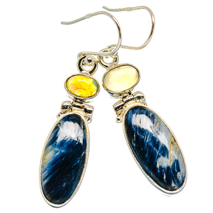 Sterling silver drop earrings with blue oval stone, yellow opal top, and hoop hooks.