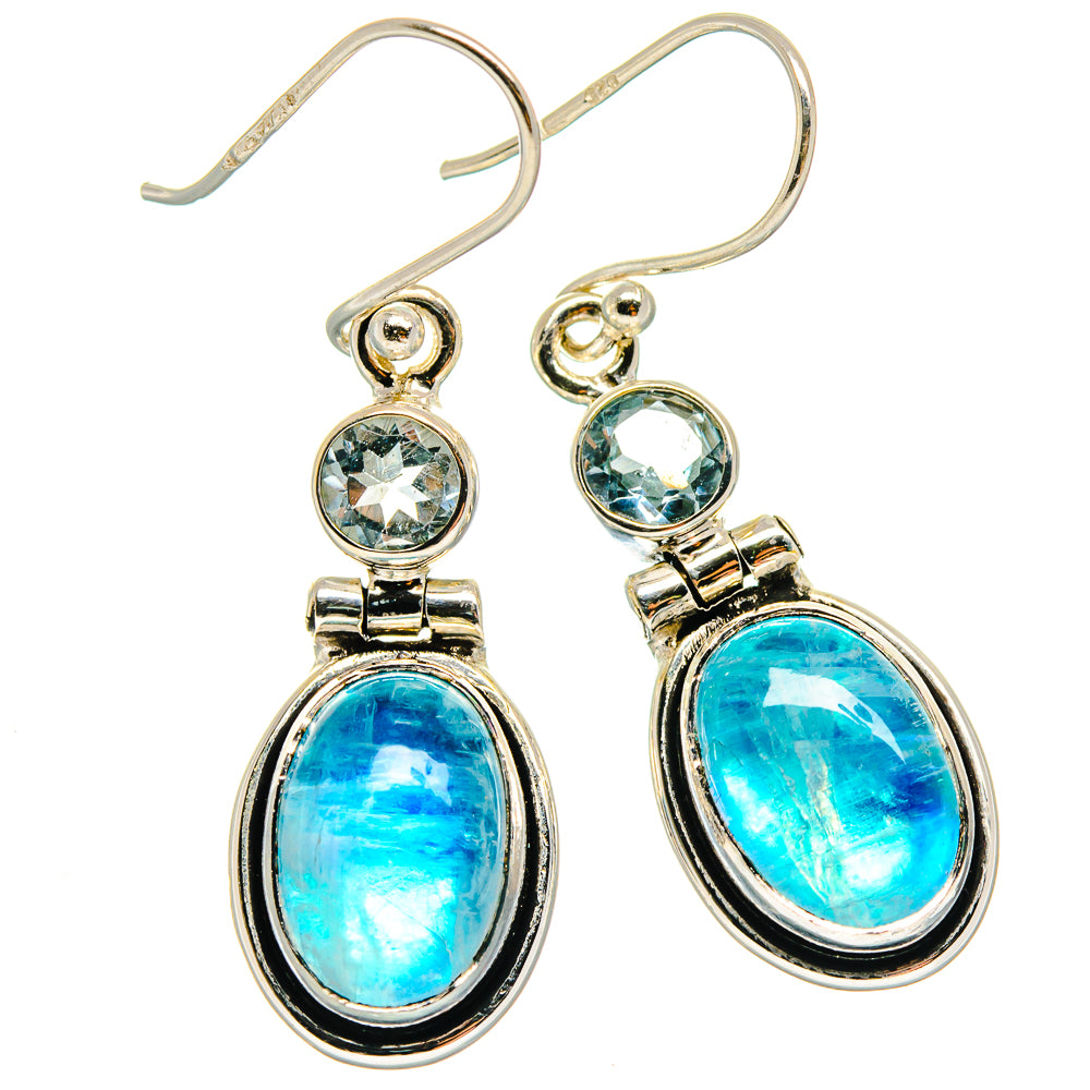 Sterling silver drop earrings with oval blue gemstones and round blue accents