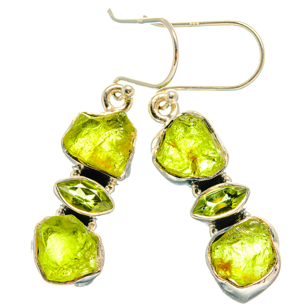 Silver hook earrings featuring three bright green rough peridot stones with faceted edges