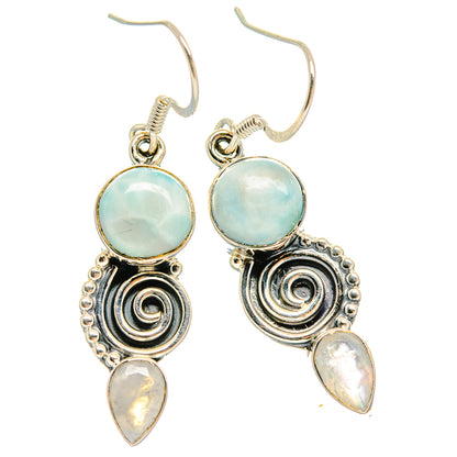 Sterling silver drop earrings with light blue round stones, spiral medallions, iridescent teardrops