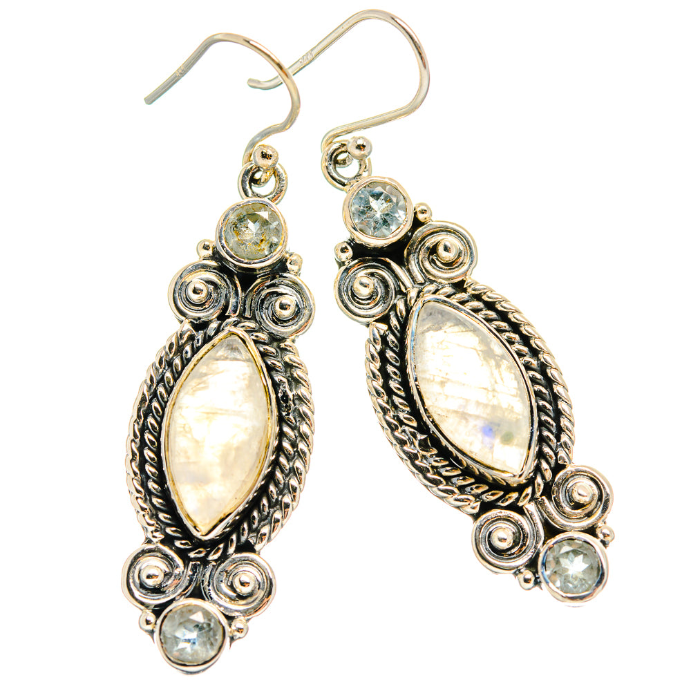 Sterling silver earrings with iridescent oval stone and small round blue accents, drop