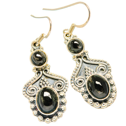 Pair of sterling silver chandelier earrings with dark star diopside ovals and hook backs