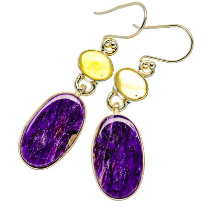 Sterling silver dangle earrings with oval purple and yellow gemstones, French hooks