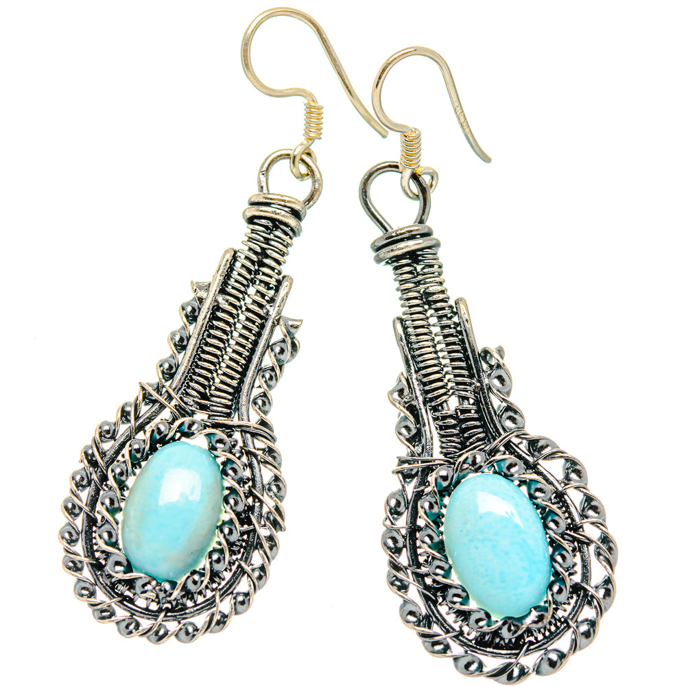 Sterling silver drop earrings with oval blue larimar, ornate teardrop filigree