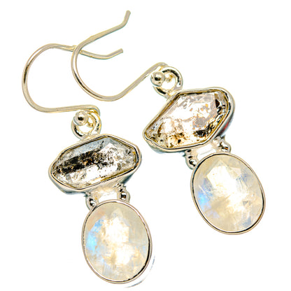 Sterling silver drop earrings with opal-like teardrop stones and oval textured accents