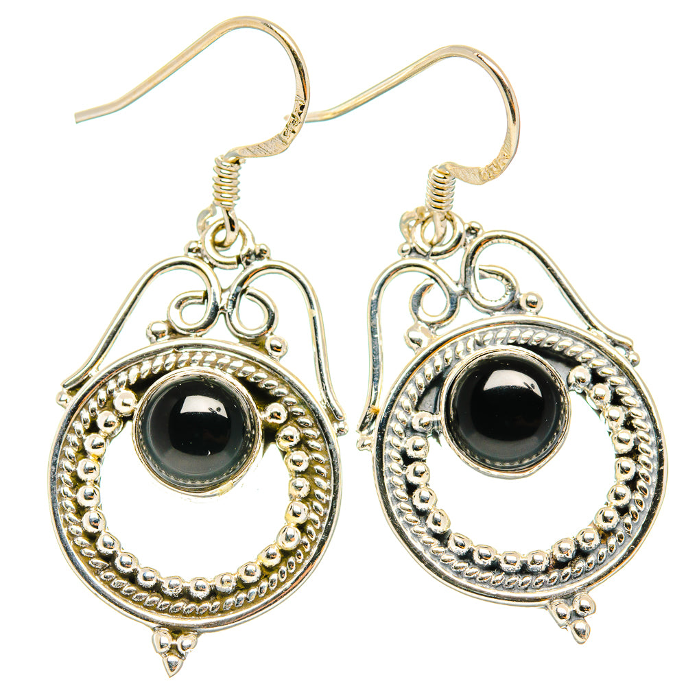 Sterling silver teardrop dangle earrings with round black onyx center and filigree