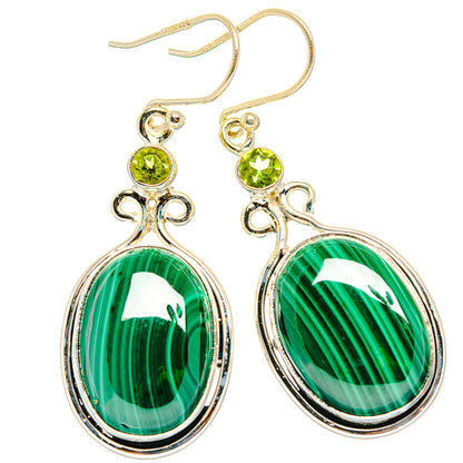 Gold-tone ear wires and silver-tone oval malachite drops with peridot stud tops