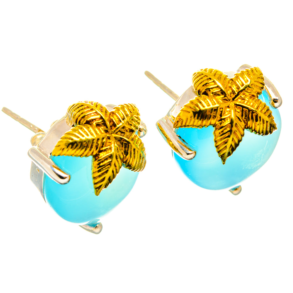 Aqua chalcedony earrings with gold-tone leaf tops and round blue stones, shown with hooks