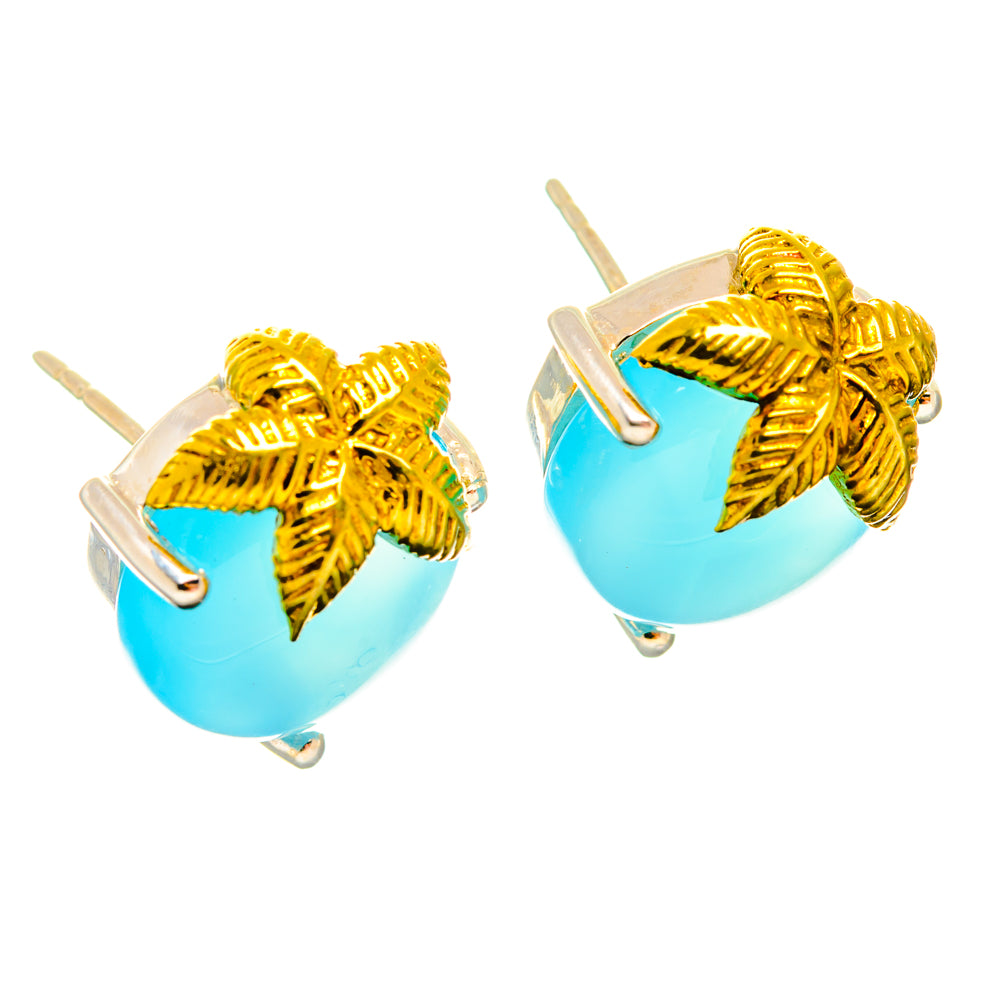 Pair of light blue chalcedony stud earrings with gold leaf caps and silver posts