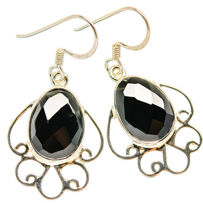 925 sterling silver black onyx teardrop earrings with ornate scroll filigree and hook closures.