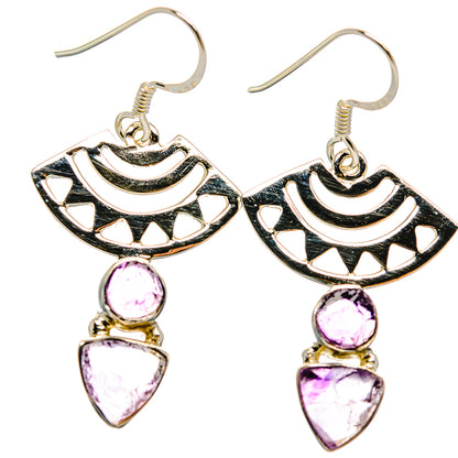 Sterling silver dangle earrings with black cutout designs and pink amethyst stones