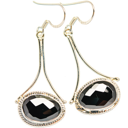 Sterling silver drop earrings with black faceted onyx teardrop stones, halo setting