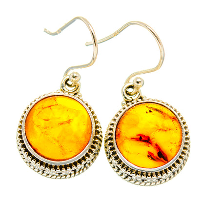 Sterling silver amber drop earrings with yellow round cabochon and textured halo border
