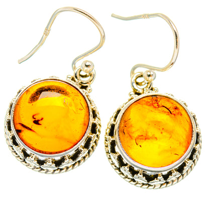 Baltic amber dangle earrings, round golden-yellow stones in ornate 925 sterling silver frames