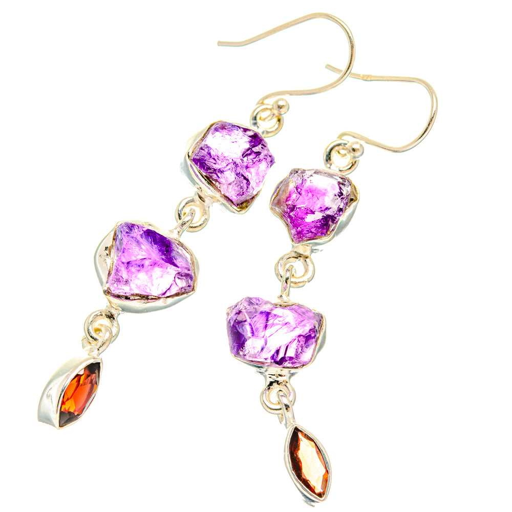 Sterling silver earrings with rough purple stones and dangling amber teardrop accents