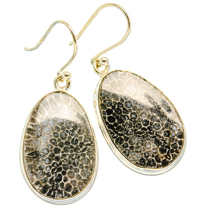 Pair of 925 sterling silver oval drop earrings with black speckled stingray coral texture.