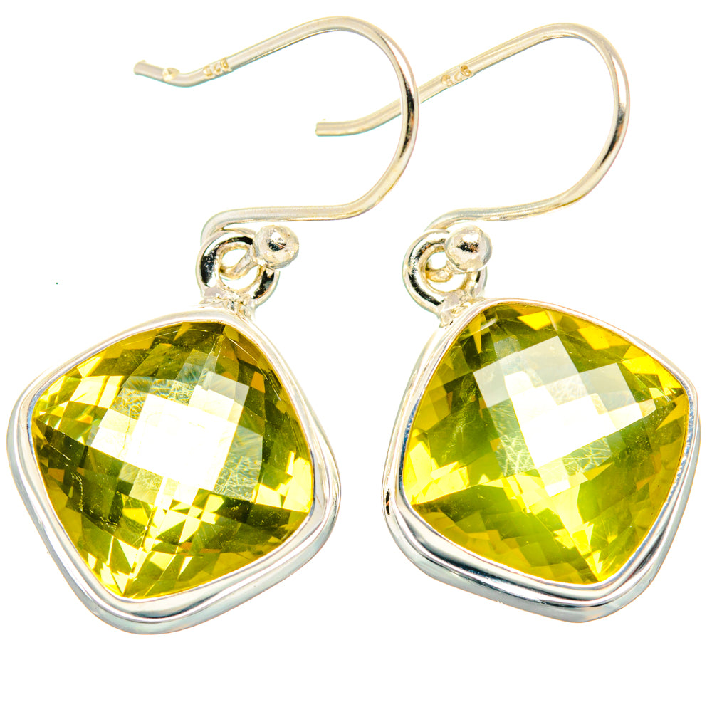 Sterling silver dangle earrings with large faceted yellow-green teardrop quartz and hook backs.