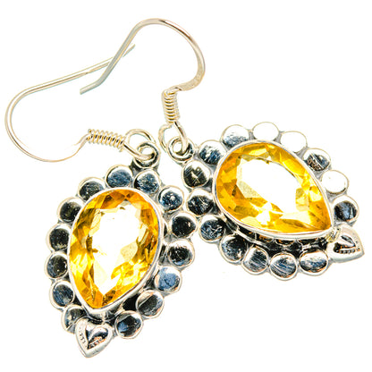 Faceted citrine dangle earrings with teardrop yellow gems and silver beaded frame