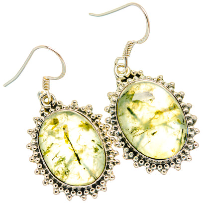 Pair of oval yellow-green prehnite earrings in ornate silver bead bezel with hooks