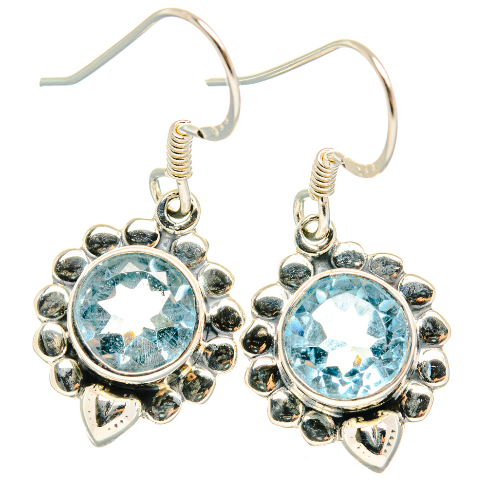 Sterling silver flower hoop earrings with round light-blue gemstone centers