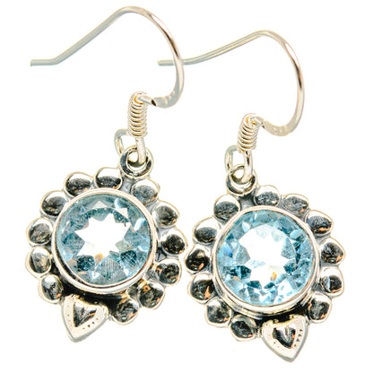 Sterling silver flower hoop earrings with round light-blue gemstone centers