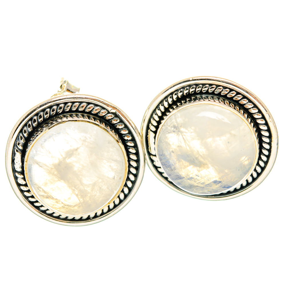 Round opalescent moonstone stud earrings with ornate sterling-silver frames, pair view