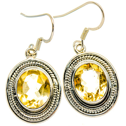 Sterling silver oval drop earrings with faceted citrine and beaded halo bezel