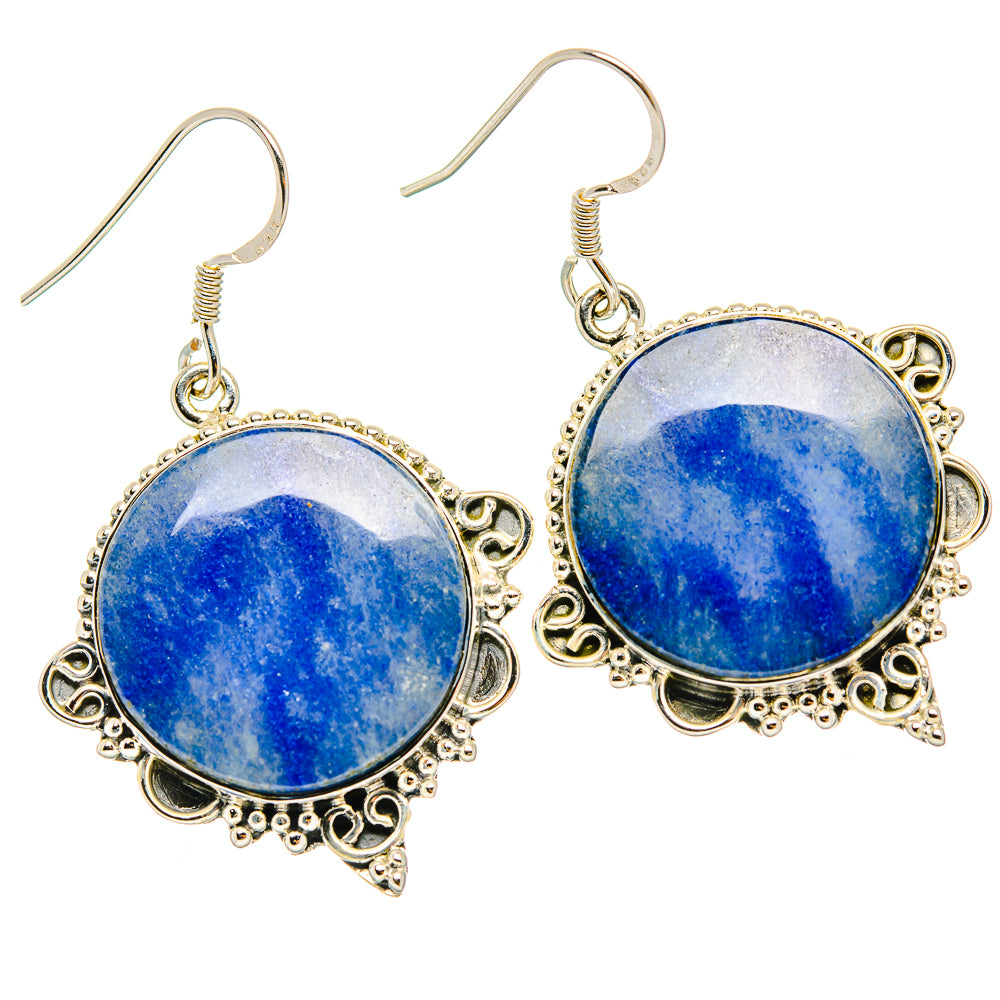 Blue sodalite dangle earrings with ornate round silver-tone bezel and fishhook backs