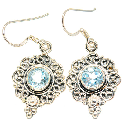 Sterling silver blue topaz earrings with French hooks, round filigree, and small bead drops