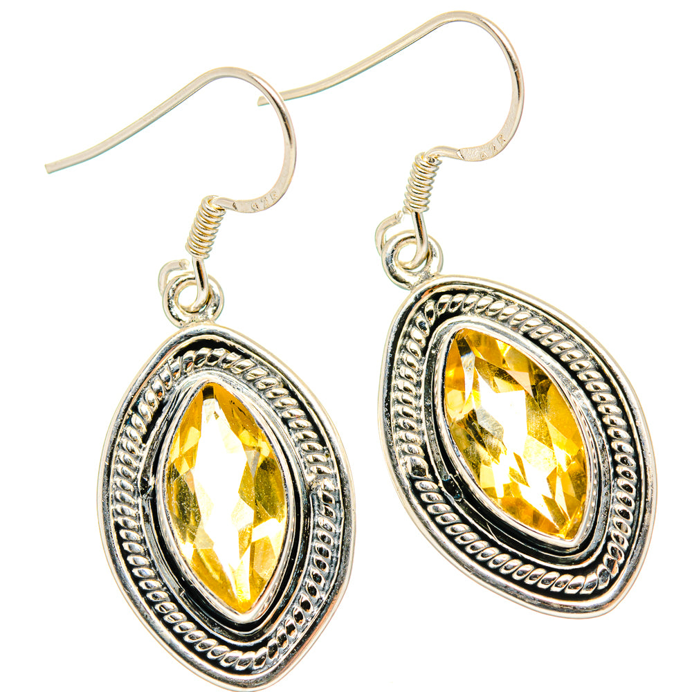 Citrine drop earrings with oval faceted stones in engraved silver settings, fishhook