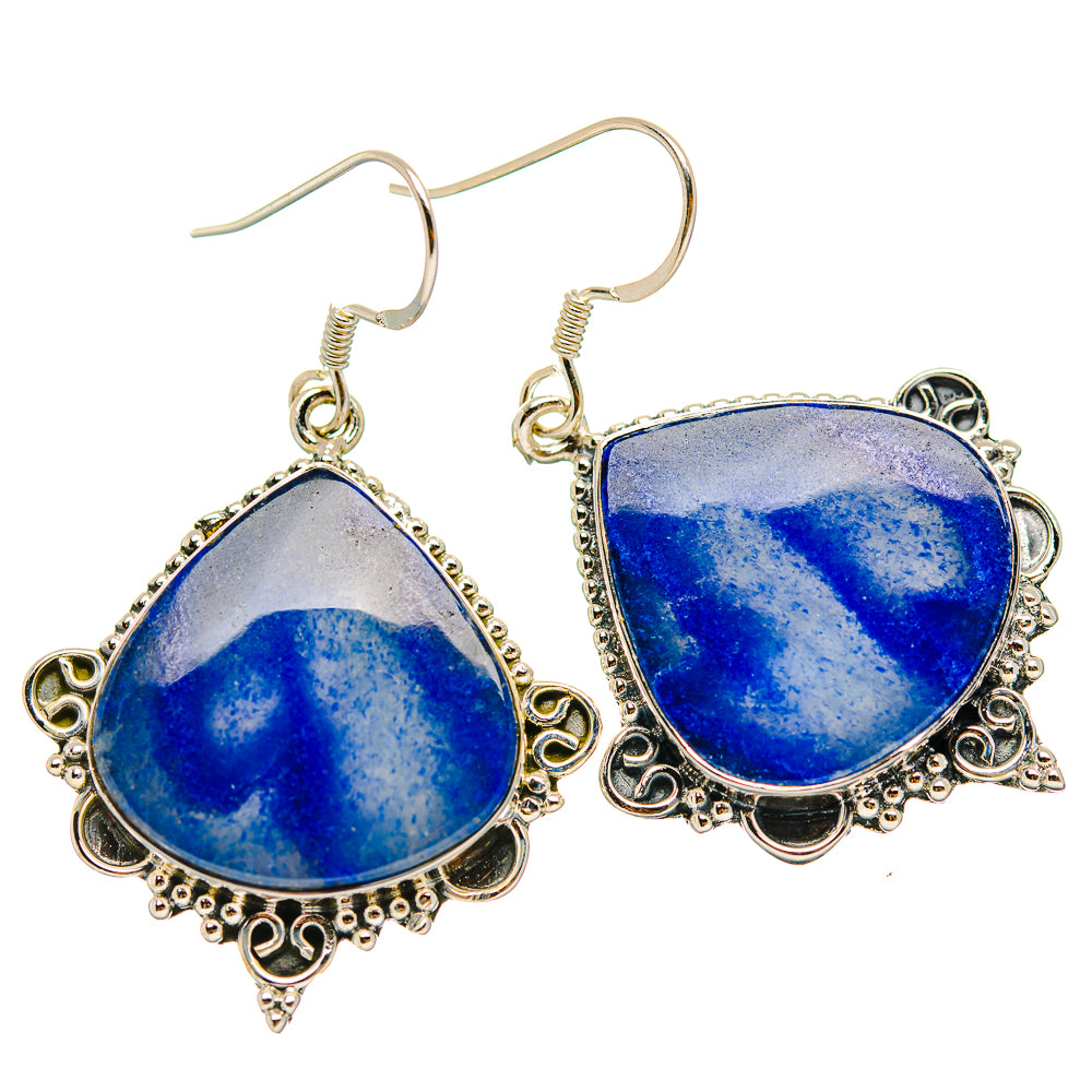 Teardrop sodalite earrings with ornate silver filigree and hook backs, blue stone