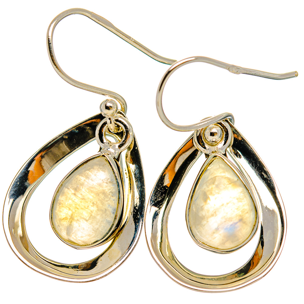 Sterling silver teardrop moonstone earrings with iridescent cream center and loop hooks.