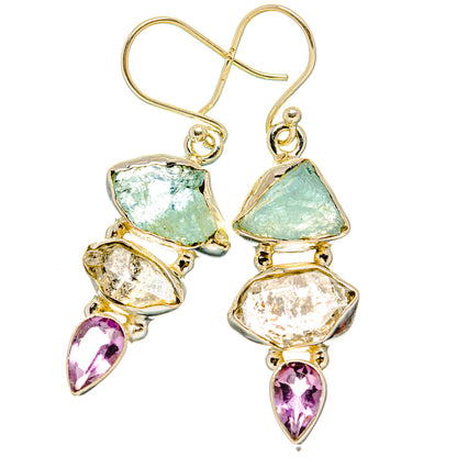 Gemstone drop earrings with aquamarine, clear, and purple teardrop accents in gold-tone